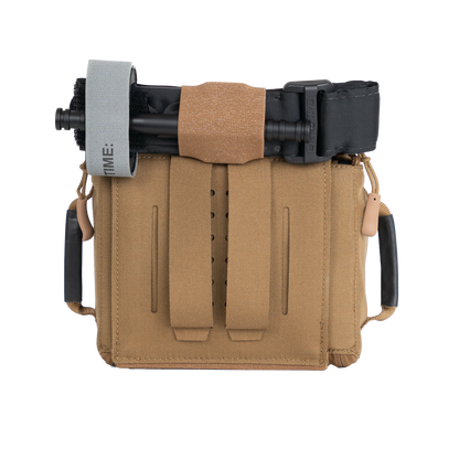 The RTS Tactical Rapid Deploy IFAK in the color Coyote brown with a tourniquet attached to the top.